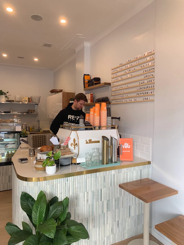 The bright counter and coffee machine inside Chimo café